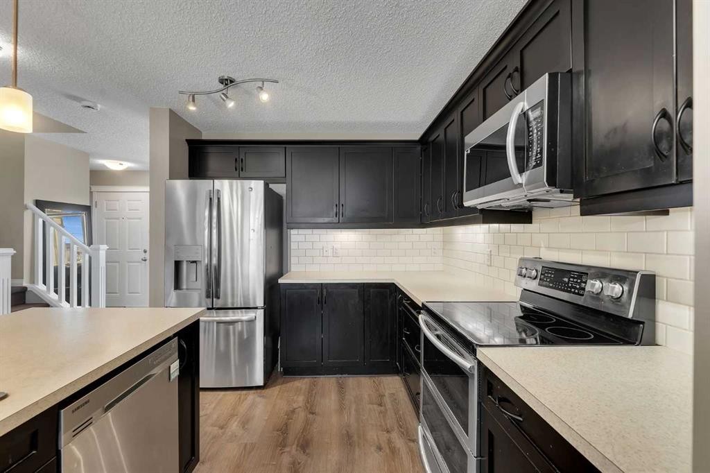 23 Copperpond Square Se, Calgary, AB - Indoor Photo Showing Kitchen With Stainless Steel Kitchen With Upgraded Kitchen