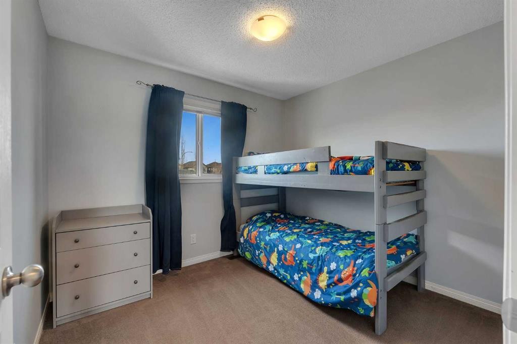 23 Copperpond Square Se, Calgary, AB - Indoor Photo Showing Bedroom