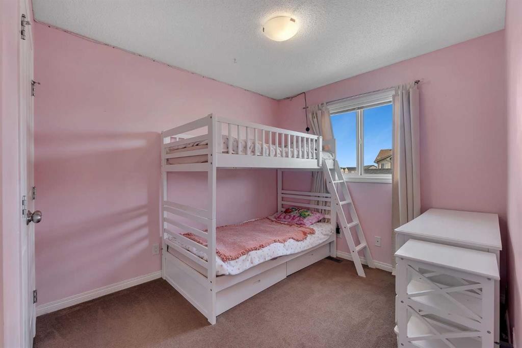 23 Copperpond Square Se, Calgary, AB - Indoor Photo Showing Bedroom