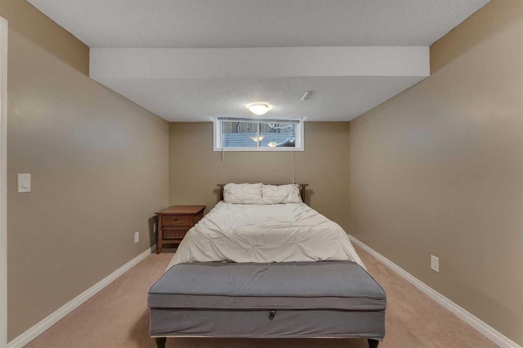 23 Copperpond Square Se, Calgary, AB - Indoor Photo Showing Bedroom