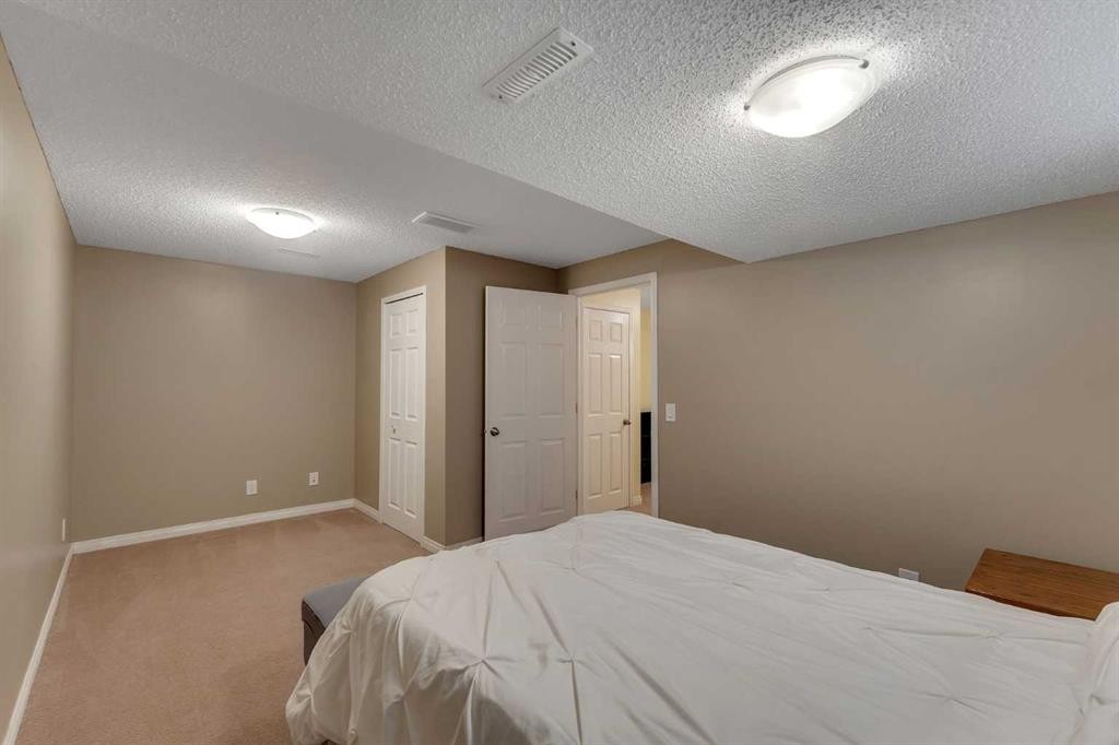 23 Copperpond Square Se, Calgary, AB - Indoor Photo Showing Bedroom