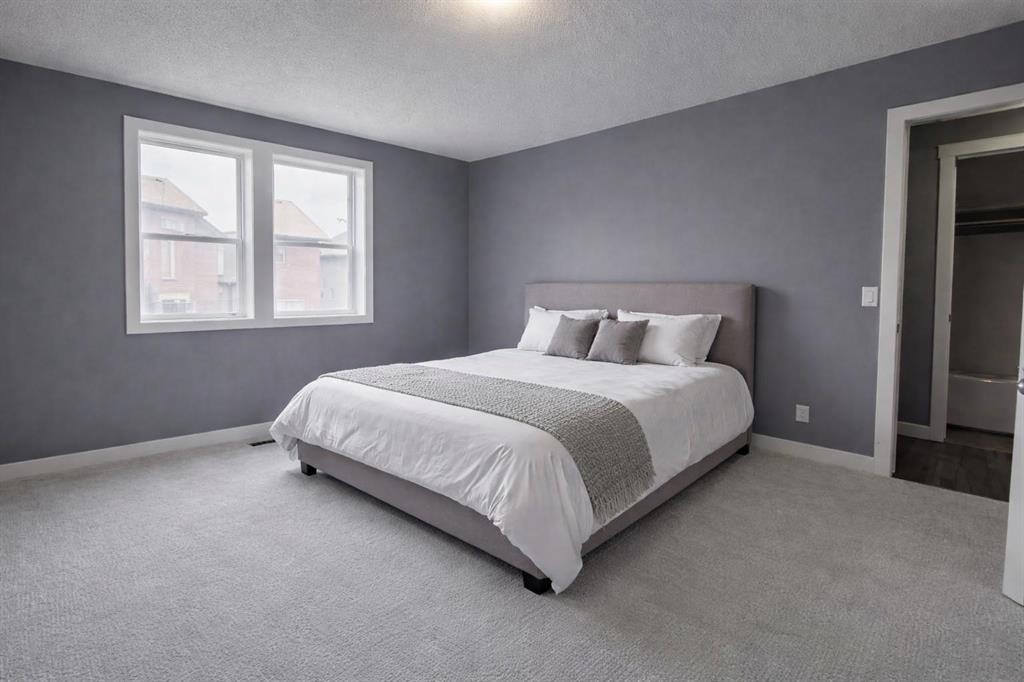 1580 New Brighton Drive Se, Calgary, AB - Indoor Photo Showing Bedroom