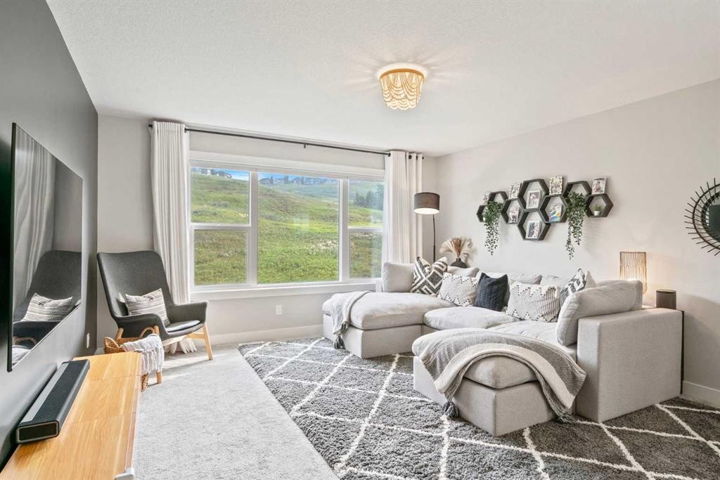 36 Cranbrook Cape Se, Calgary, AB - Indoor Photo Showing Living Room
