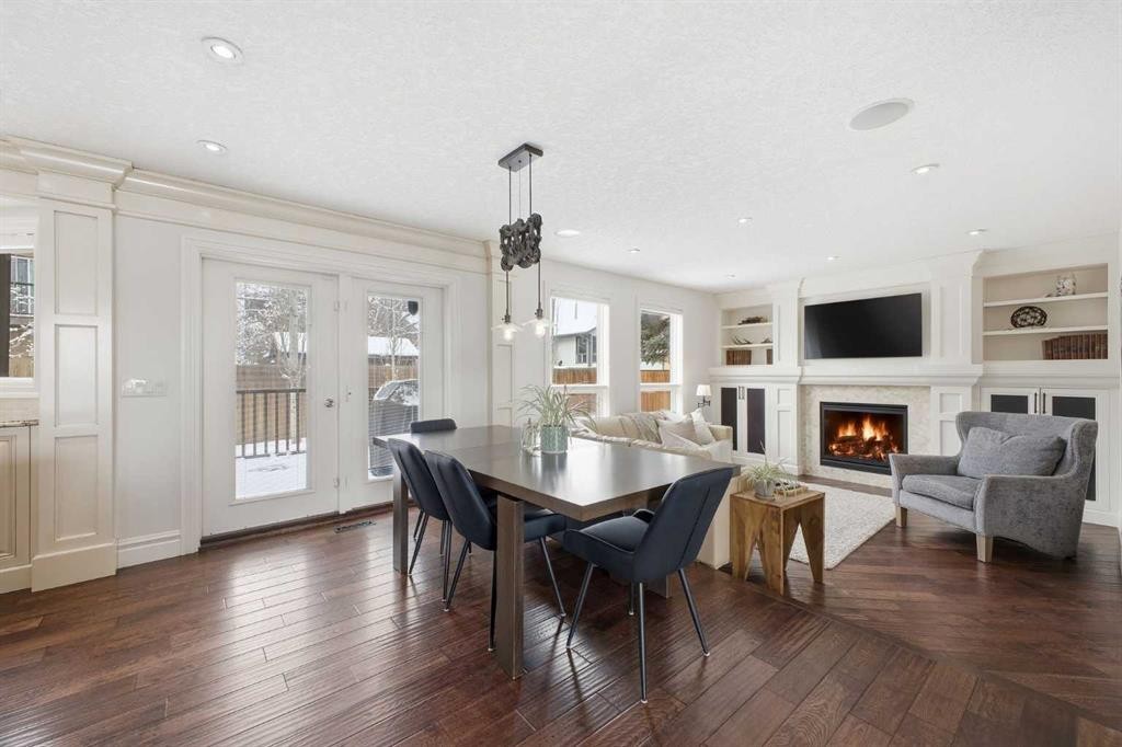 23 Deermoss Place Se, Calgary, AB - Indoor Photo Showing Dining Room With Fireplace