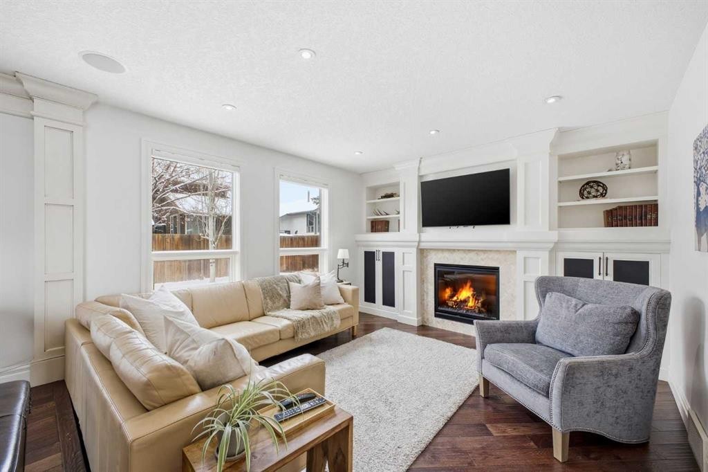 23 Deermoss Place Se, Calgary, AB - Indoor Photo Showing Living Room With Fireplace