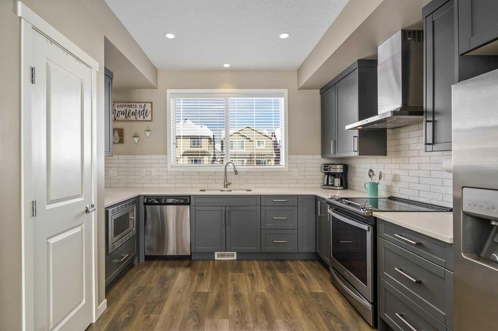 15 Masters Square Se, Calgary, AB - Indoor Photo Showing Kitchen With Stainless Steel Kitchen With Upgraded Kitchen