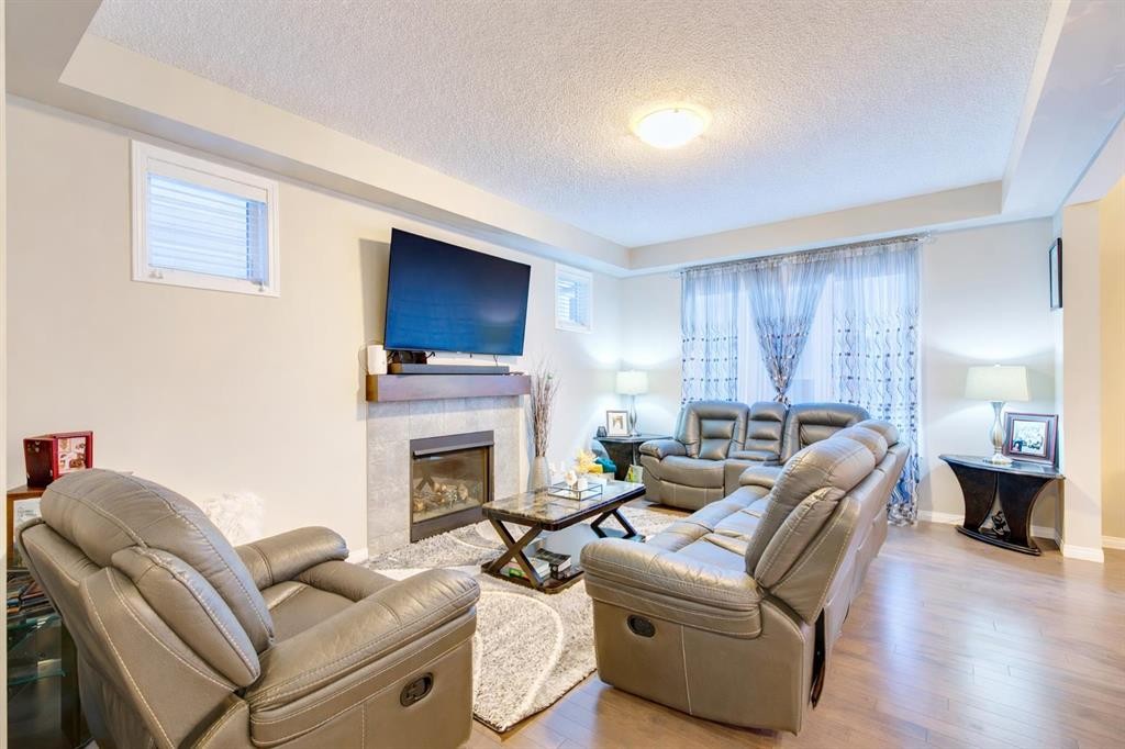 61 Cityscape View Ne, Calgary, AB - Indoor Photo Showing Living Room With Fireplace
