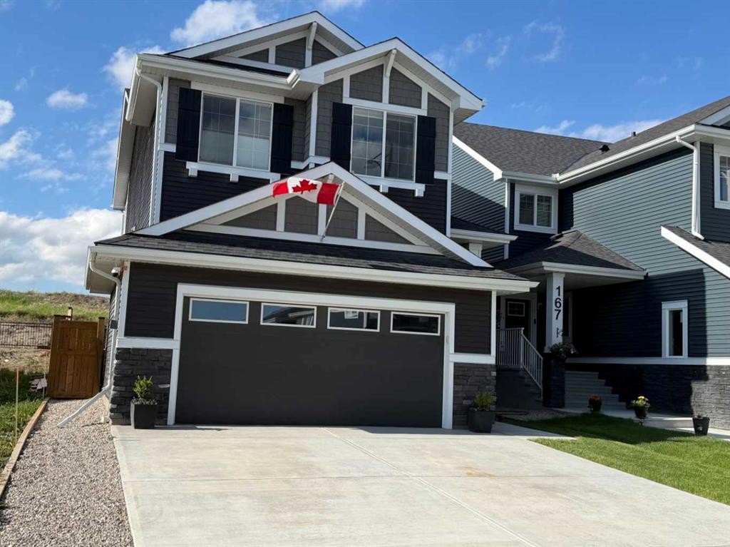 163 Sundown Crescent, Cochrane, AB - Outdoor With Facade