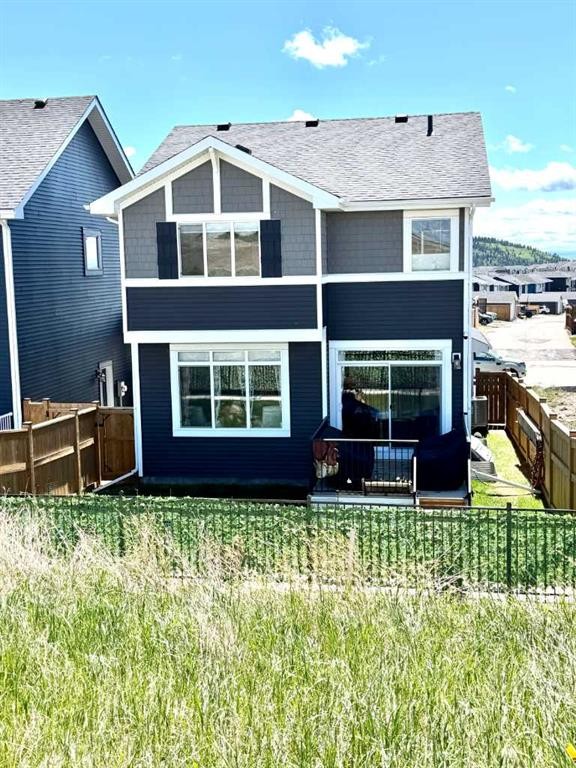 163 Sundown Crescent, Cochrane, AB - Outdoor With Facade