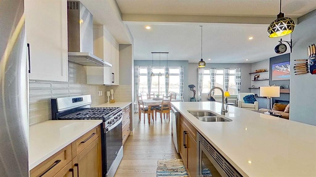 163 Sundown Crescent, Cochrane, AB - Indoor Photo Showing Kitchen With Double Sink With Upgraded Kitchen