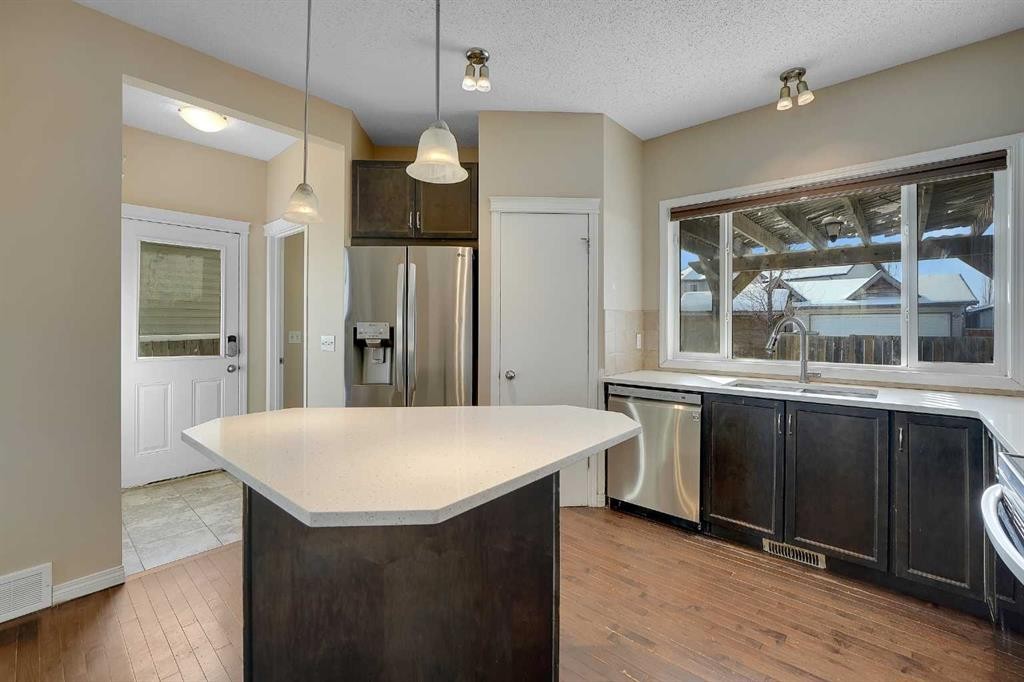 1833 New Brighton Drive Se, Calgary, AB - Indoor Photo Showing Kitchen With Stainless Steel Kitchen