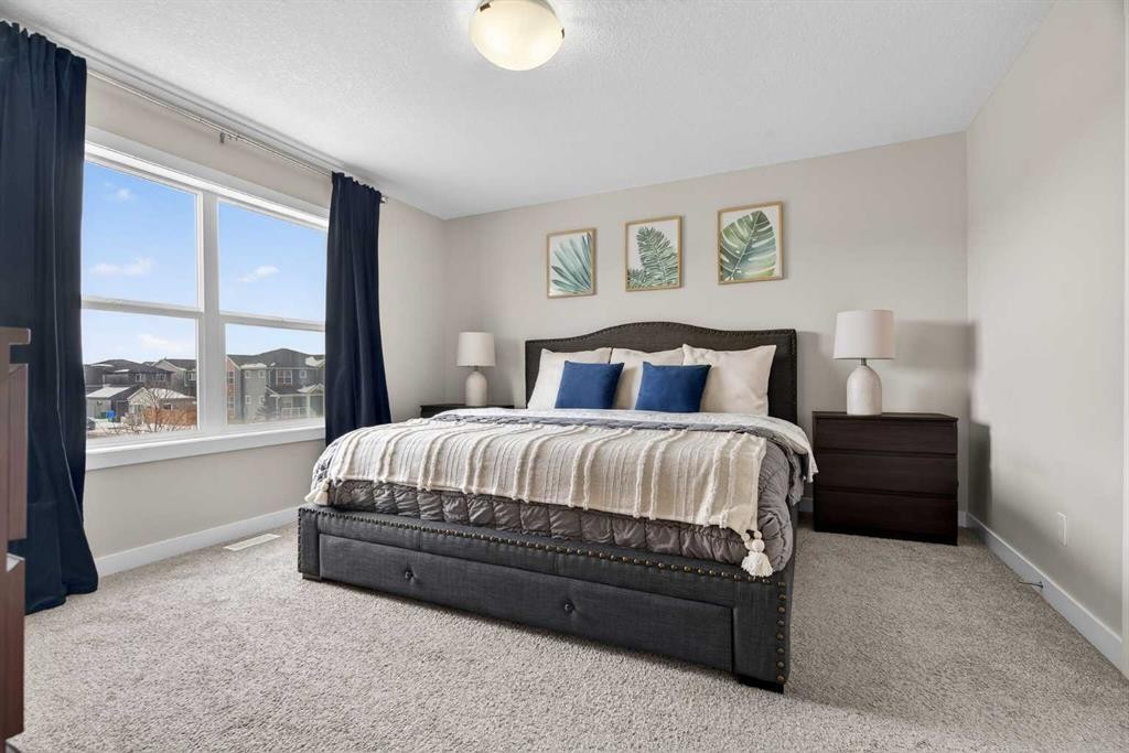 67 Wolf Willow Boulevard Se, Calgary, AB - Indoor Photo Showing Bedroom