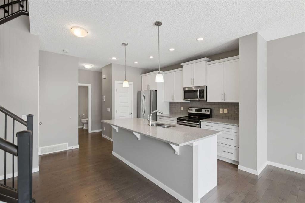 54 Legacy Close Se, Calgary, AB - Indoor Photo Showing Kitchen With Double Sink With Upgraded Kitchen
