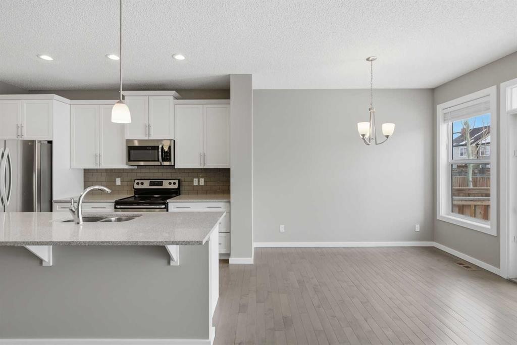 54 Legacy Close Se, Calgary, AB - Indoor Photo Showing Kitchen With Stainless Steel Kitchen With Double Sink With Upgraded Kitchen