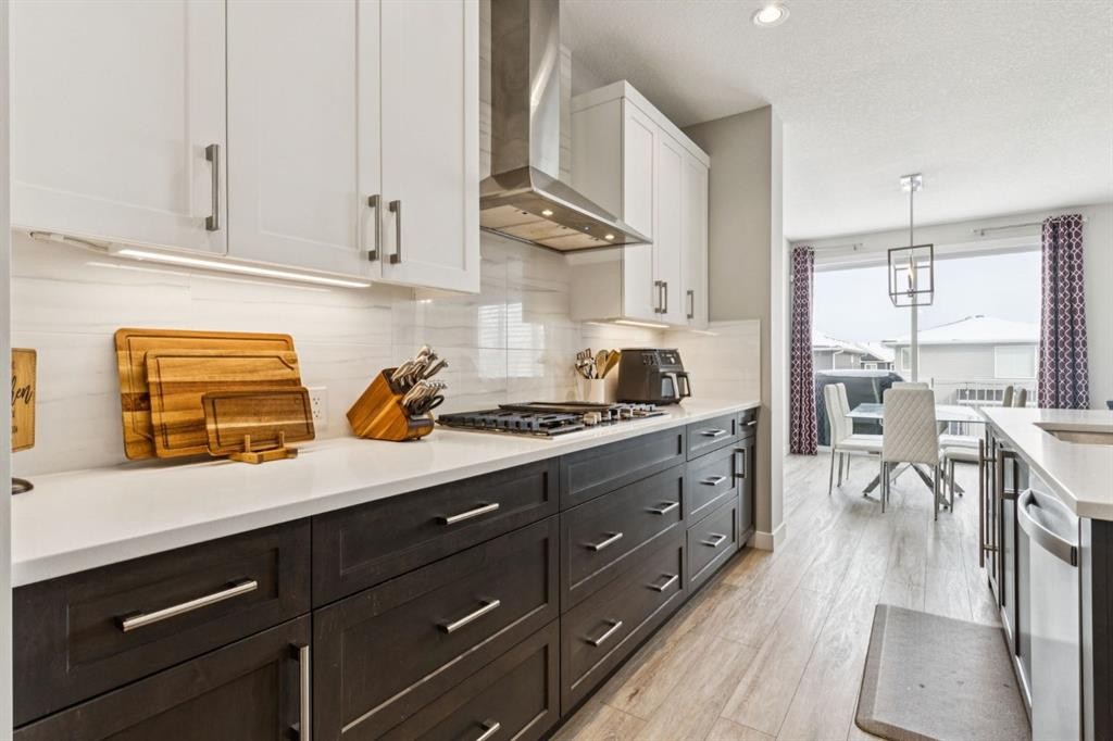 415 Rivercrest Boulevard, Cochrane, AB - Indoor Photo Showing Kitchen With Upgraded Kitchen