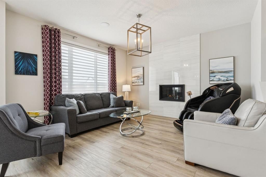 415 Rivercrest Boulevard, Cochrane, AB - Indoor Photo Showing Living Room With Fireplace
