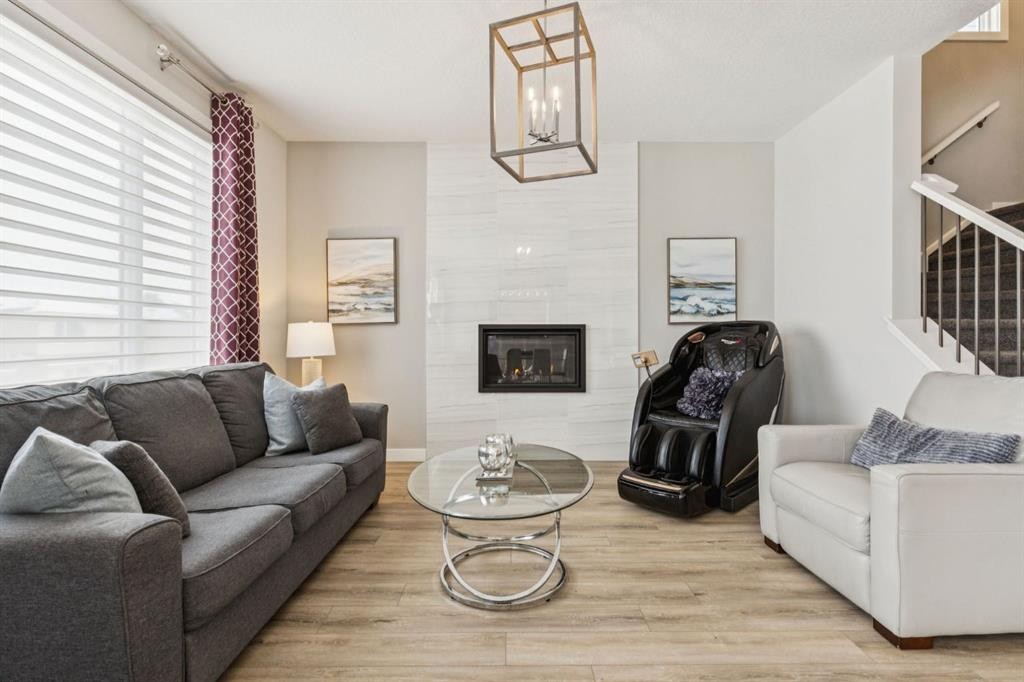 415 Rivercrest Boulevard, Cochrane, AB - Indoor Photo Showing Living Room With Fireplace