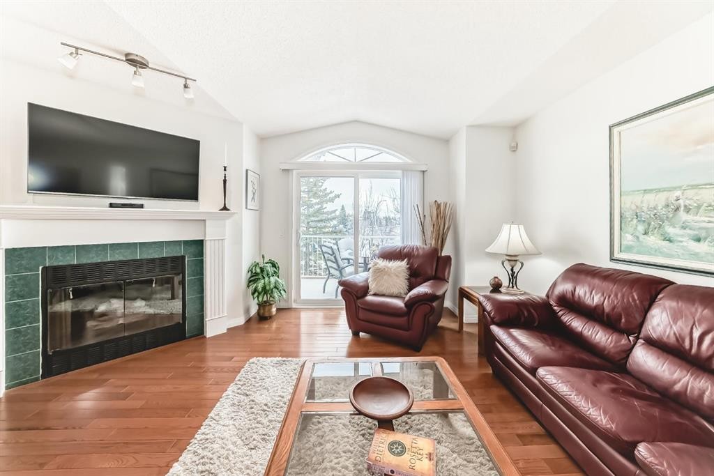 157 Hawkstone Manor Nw, Calgary, AB - Indoor Photo Showing Living Room With Fireplace