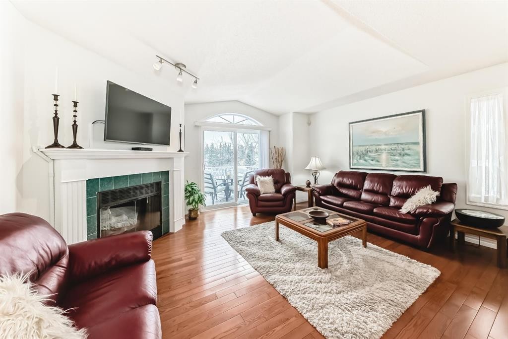 157 Hawkstone Manor Nw, Calgary, AB - Indoor Photo Showing Living Room With Fireplace