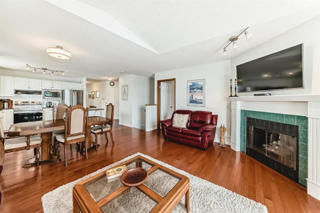 157 Hawkstone Manor Nw, Calgary, AB - Indoor Photo Showing Living Room With Fireplace