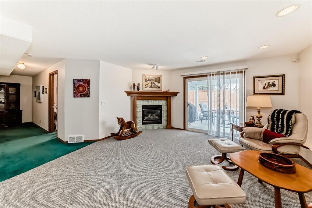 157 Hawkstone Manor Nw, Calgary, AB - Indoor Photo Showing Living Room With Fireplace