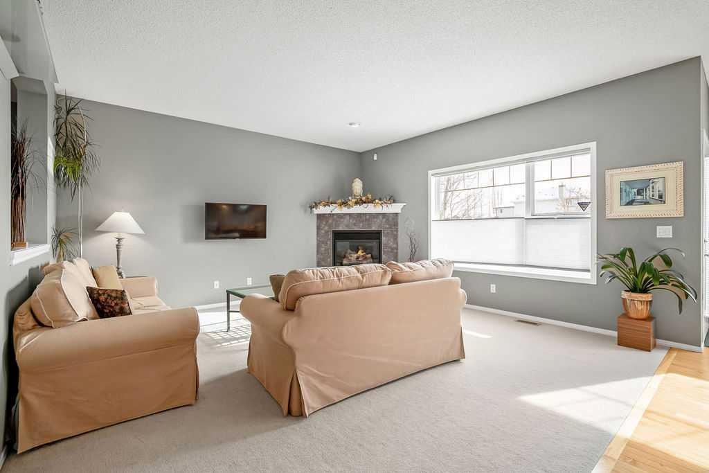86 Evergreen Common Sw, Calgary, AB - Indoor Photo Showing Living Room With Fireplace