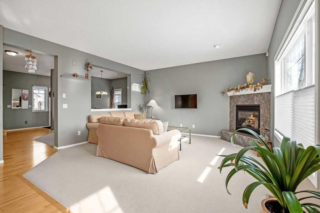 86 Evergreen Common Sw, Calgary, AB - Indoor Photo Showing Living Room With Fireplace
