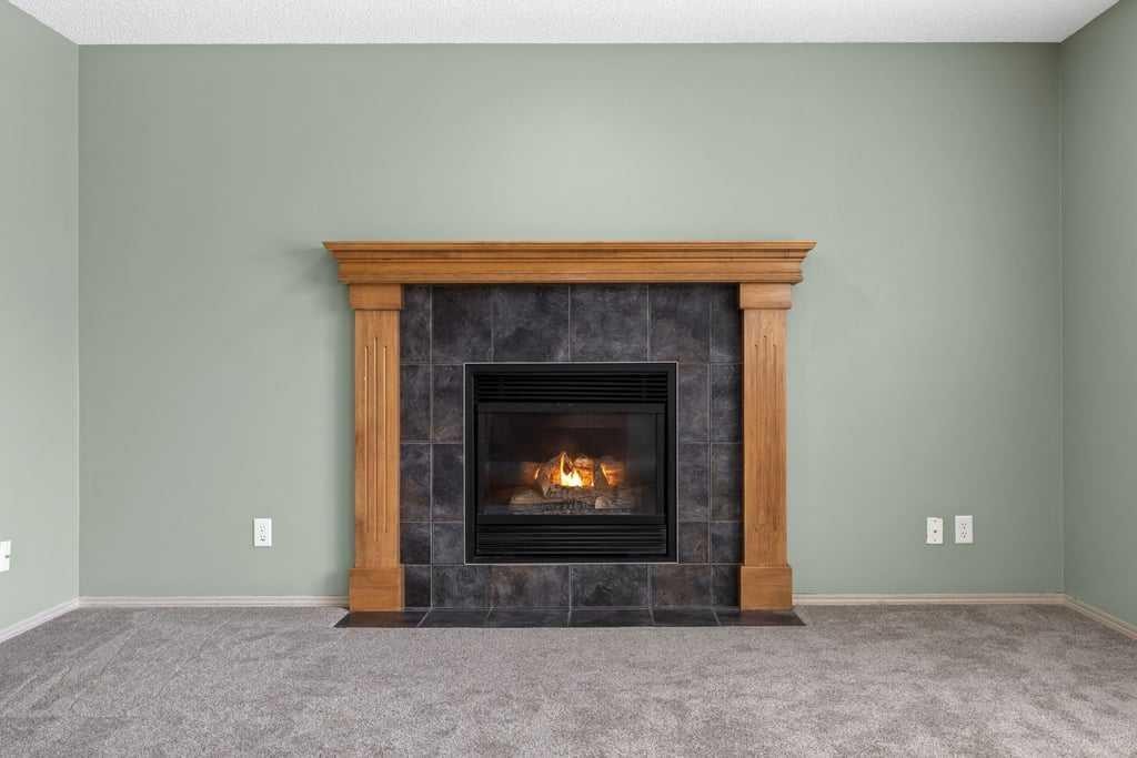 19 Sienna Park Crescent Sw, Calgary, AB - Indoor Photo Showing Living Room With Fireplace