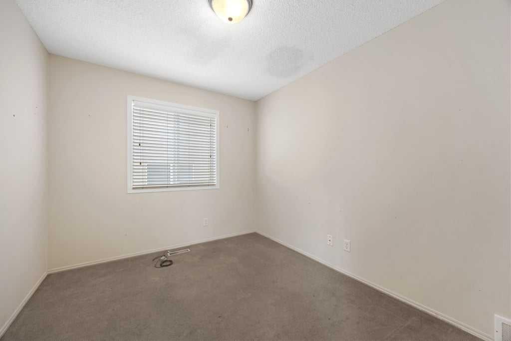 19 Sienna Park Crescent Sw, Calgary, AB - Indoor Photo Showing Other Room