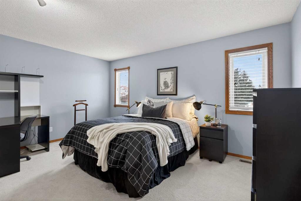 677 Hawkwood Boulevard Nw, Calgary, AB - Indoor Photo Showing Bedroom