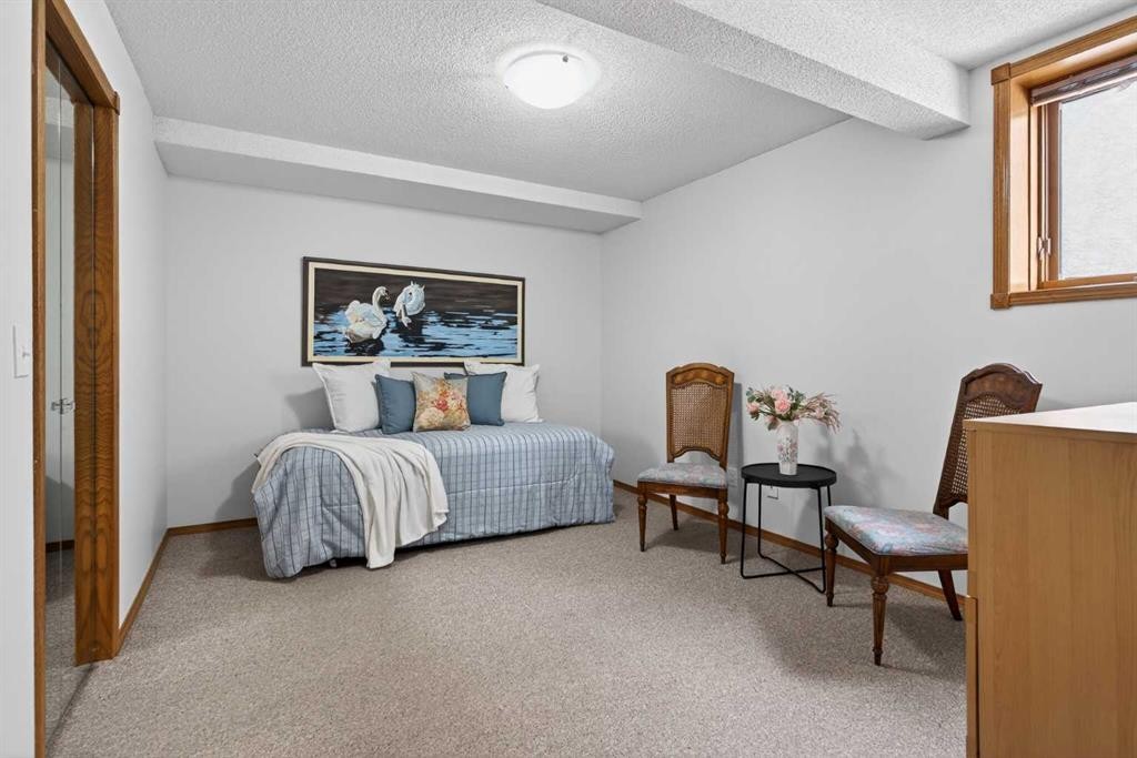 677 Hawkwood Boulevard Nw, Calgary, AB - Indoor Photo Showing Bedroom