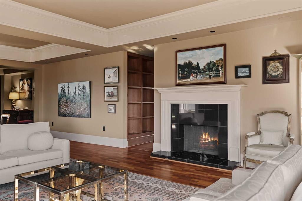 3S-222 Eagle Ridge Drive Sw, Calgary, AB - Indoor Photo Showing Living Room With Fireplace