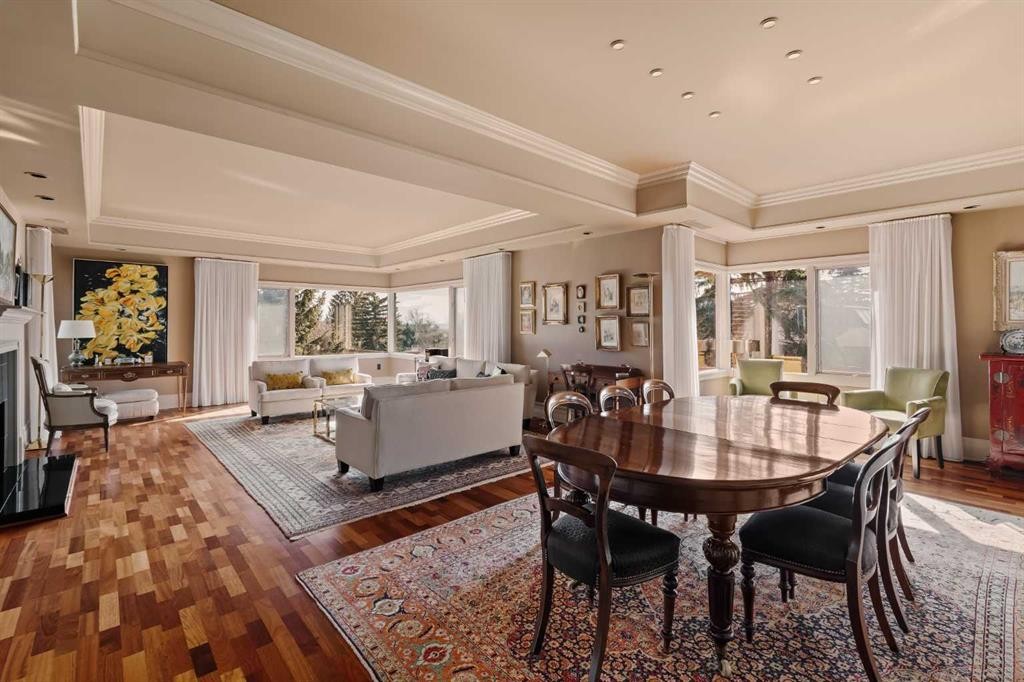 3S-222 Eagle Ridge Drive Sw, Calgary, AB - Indoor Photo Showing Dining Room With Fireplace