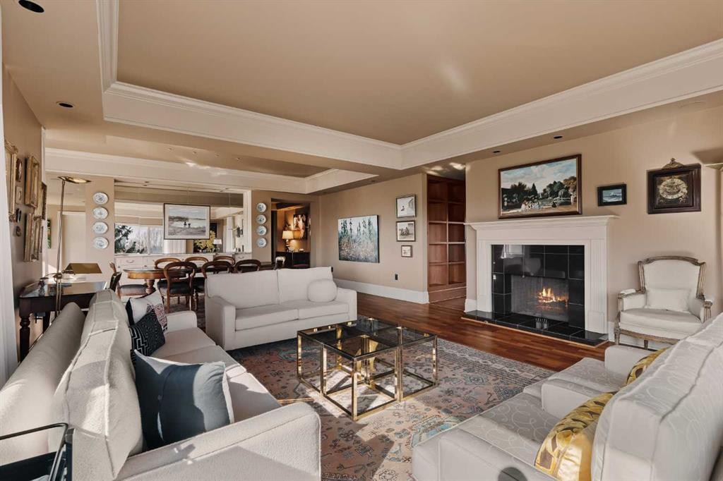 3S-222 Eagle Ridge Drive Sw, Calgary, AB - Indoor Photo Showing Living Room With Fireplace