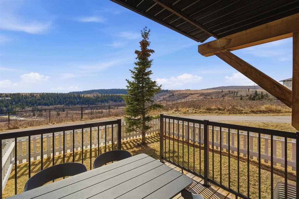 1208 Jumping Pound Common, Cochrane, AB - Outdoor With Deck Patio Veranda With View With Exterior