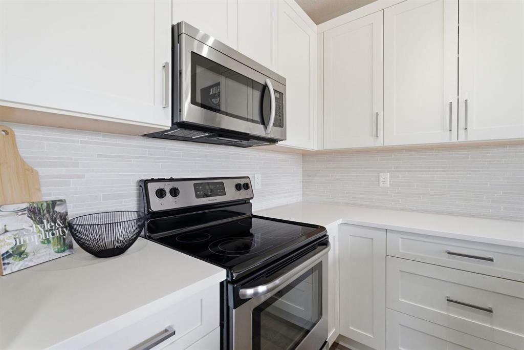 1208 Jumping Pound Common, Cochrane, AB - Indoor Photo Showing Kitchen