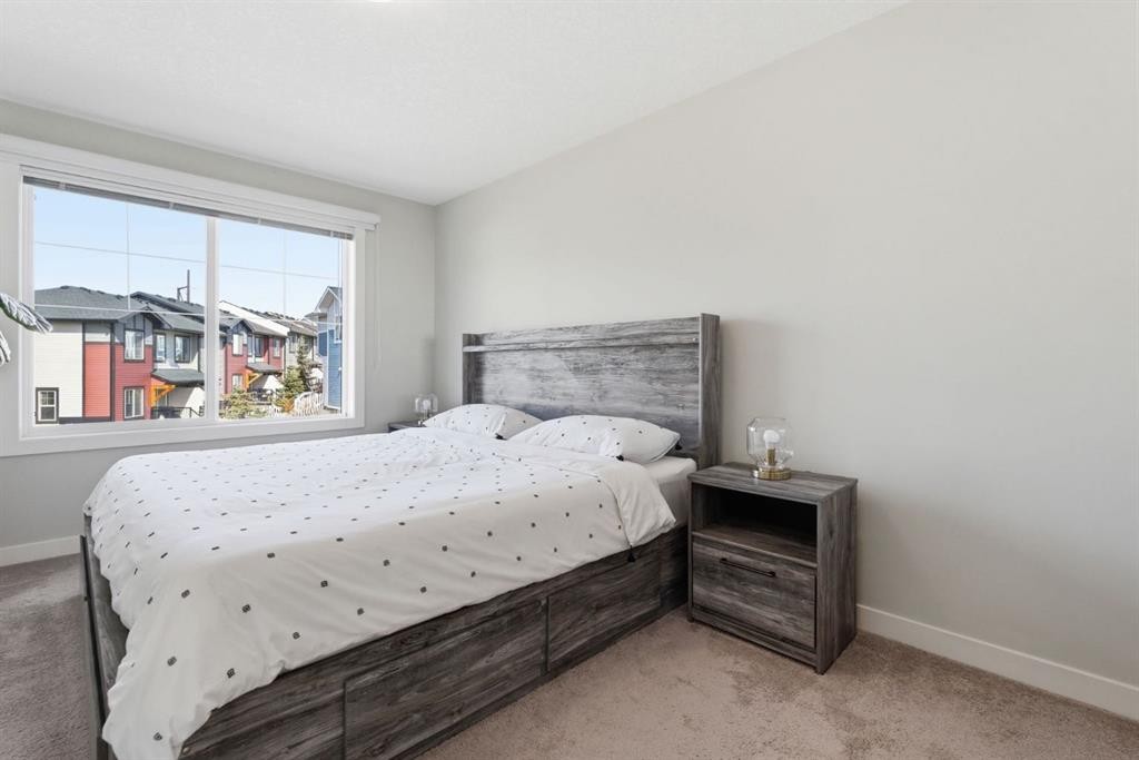 1208 Jumping Pound Common, Cochrane, AB - Indoor Photo Showing Bedroom