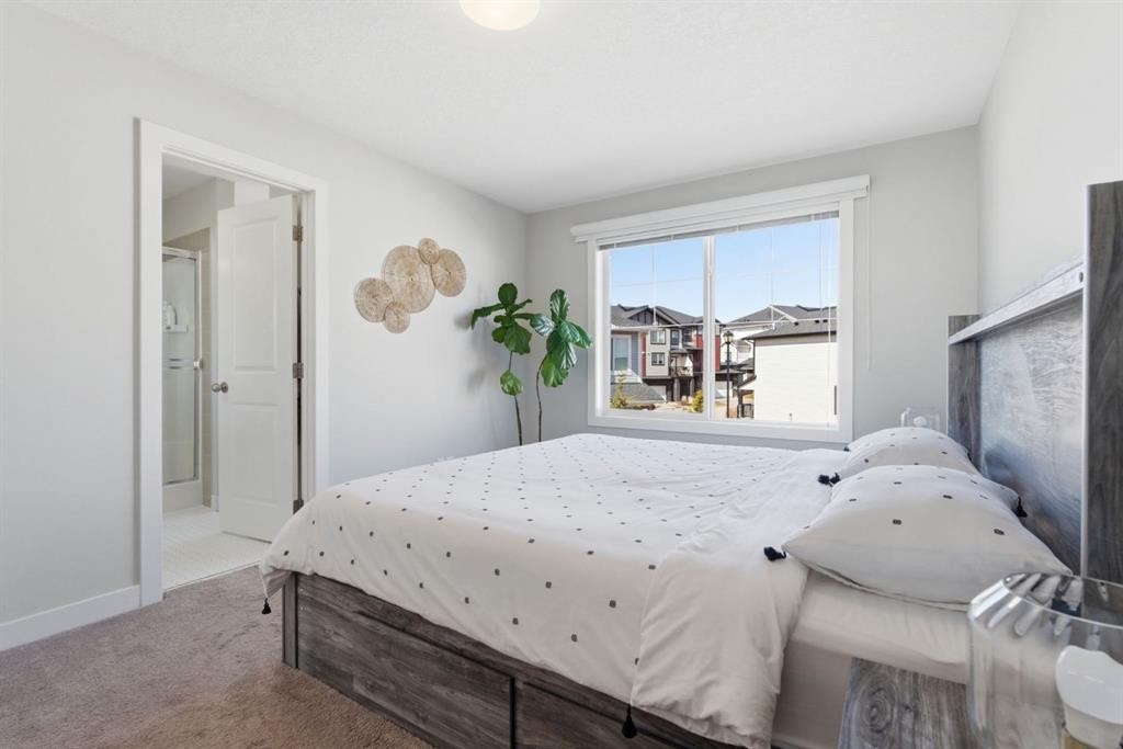 1208 Jumping Pound Common, Cochrane, AB - Indoor Photo Showing Bedroom