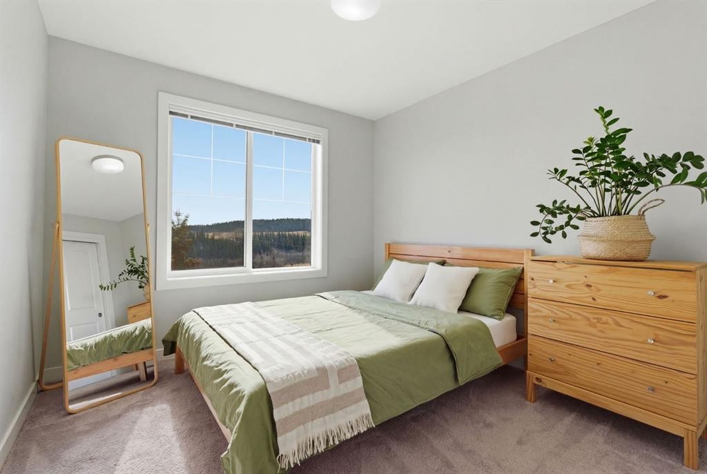 1208 Jumping Pound Common, Cochrane, AB - Indoor Photo Showing Bedroom