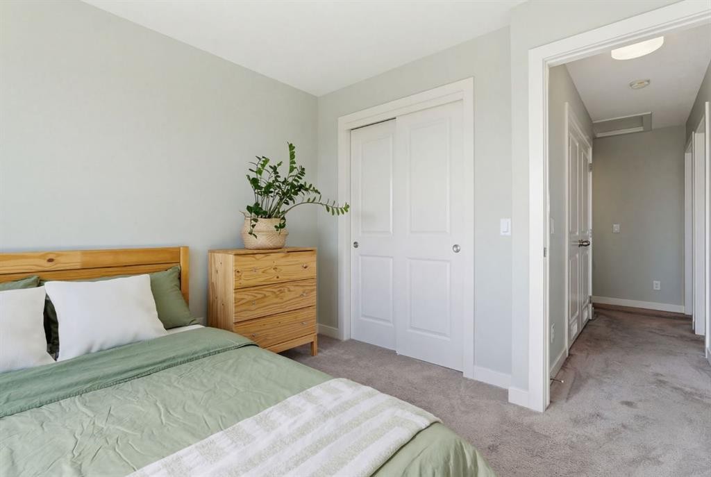 1208 Jumping Pound Common, Cochrane, AB - Indoor Photo Showing Bedroom