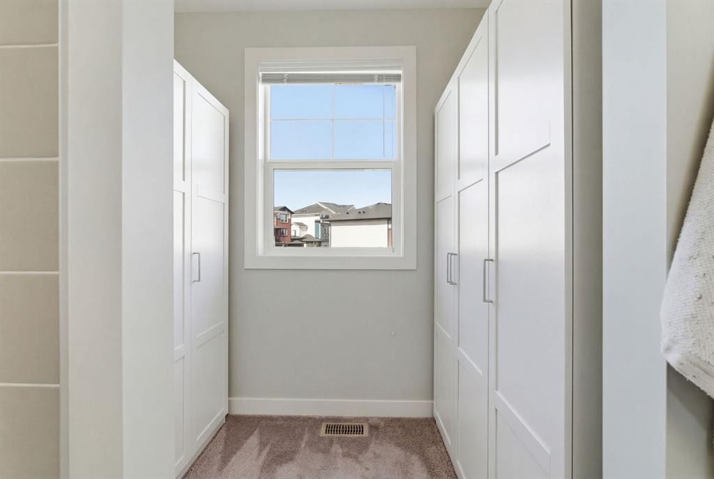 1208 Jumping Pound Common, Cochrane, AB - Indoor Photo Showing Other Room