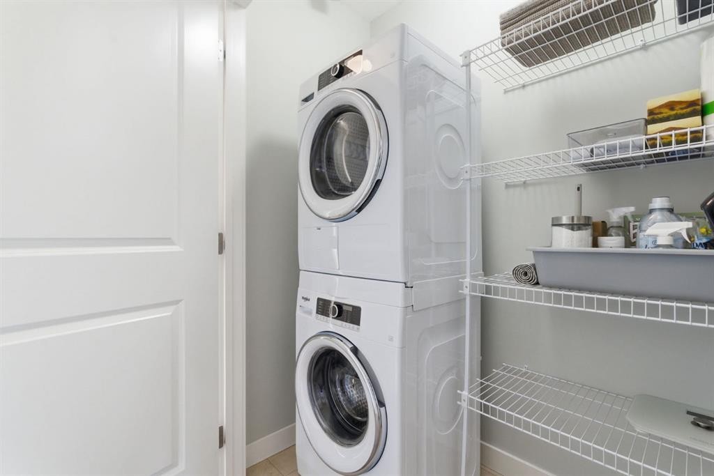 1208 Jumping Pound Common, Cochrane, AB - Indoor Photo Showing Laundry Room