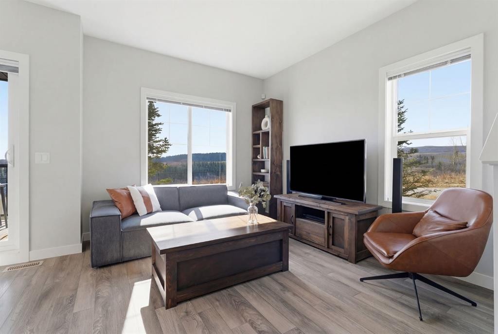 1208 Jumping Pound Common, Cochrane, AB - Indoor Photo Showing Living Room