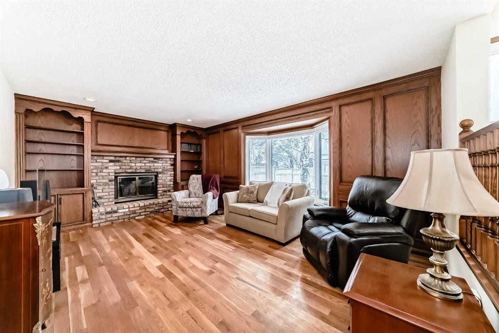 204 Edcath Place Nw, Calgary, AB - Indoor Photo Showing Living Room With Fireplace