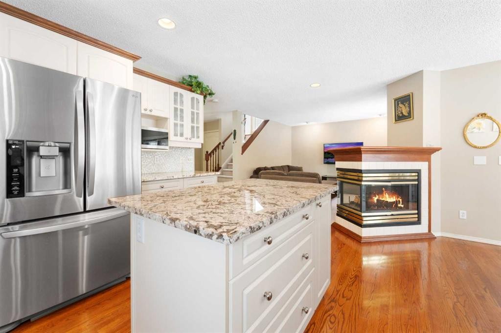 69 Hampstead Gardens Nw, Calgary, AB - Indoor Photo Showing Kitchen With Fireplace With Upgraded Kitchen