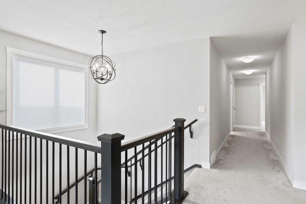 36 Cranbrook Cape Se, Calgary, AB - Indoor Photo Showing Other Room