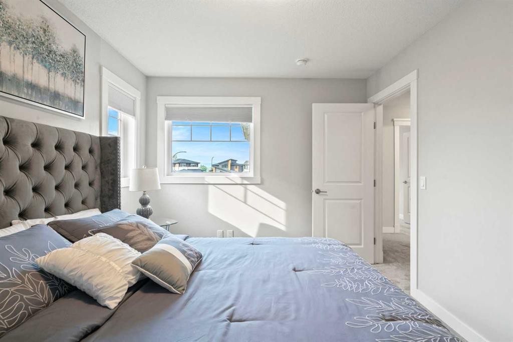 36 Cranbrook Cape Se, Calgary, AB - Indoor Photo Showing Bedroom