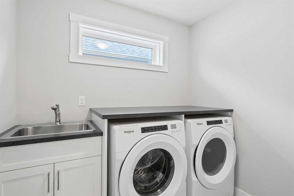36 Cranbrook Cape Se, Calgary, AB - Indoor Photo Showing Laundry Room