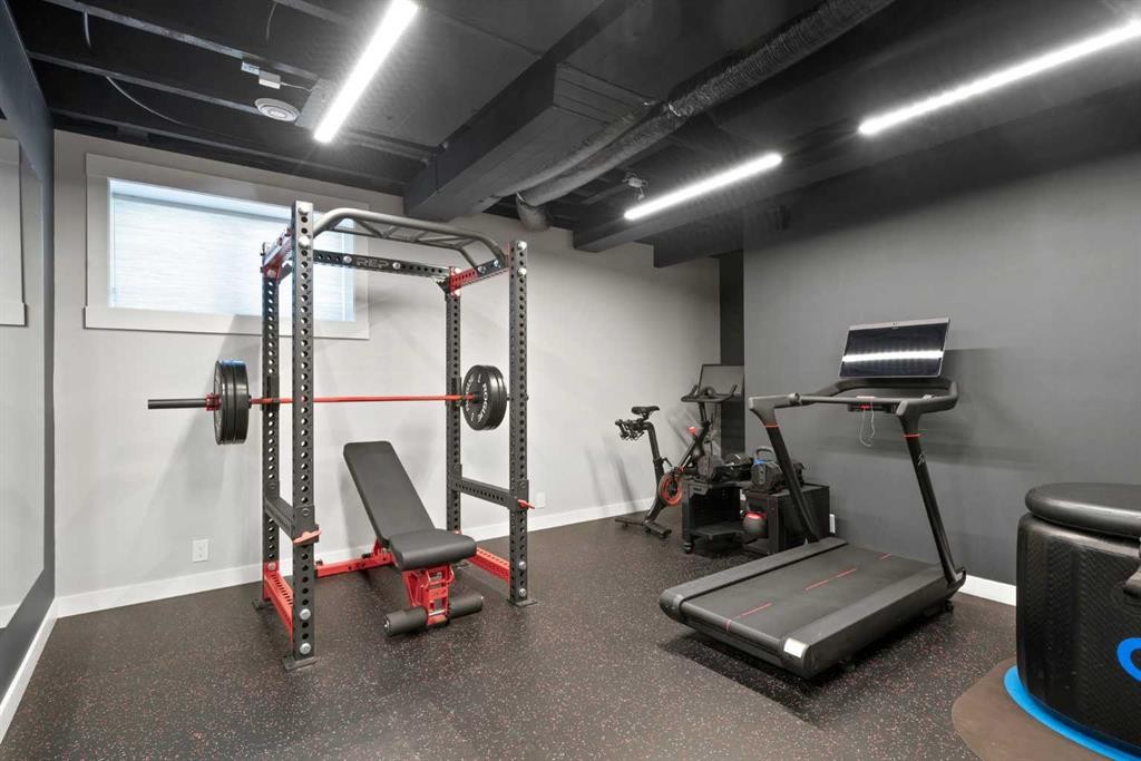 36 Cranbrook Cape Se, Calgary, AB - Indoor Photo Showing Gym Room