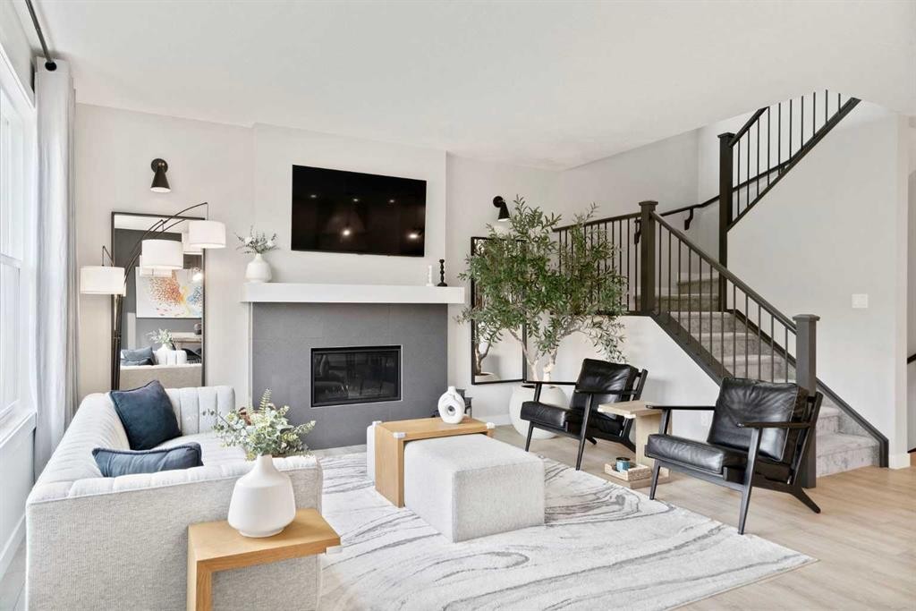 36 Cranbrook Cape Se, Calgary, AB - Indoor Photo Showing Living Room With Fireplace